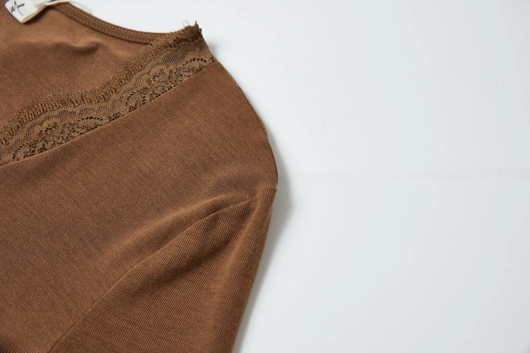 An image of a   6154Q Laced and Layered Knit Top by  Mirra Masa