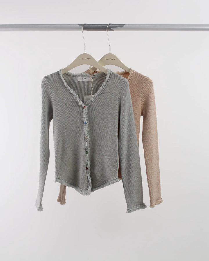 An image of a   7494Q Hearty Button Cardigan with Frayed Hem by  Mirra Masa