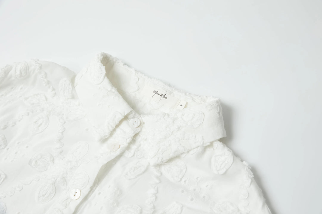 An image of a   8225C Embroidery Blouse by  Mirra Masa