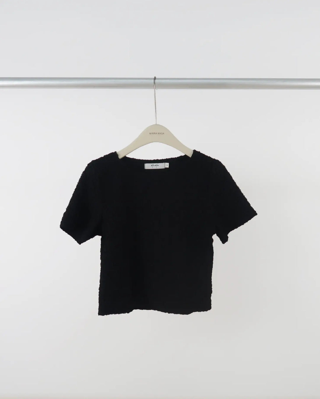 An image of a  Black-One-Size JL2504 Short-Sleeve Top by  Mirra Masa