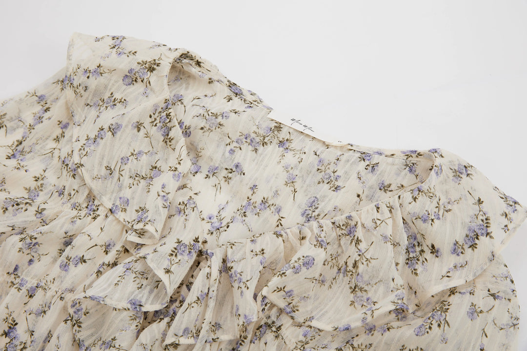 An image of a   M16749 Ruffled Floral Blouse by  Mirra Masa