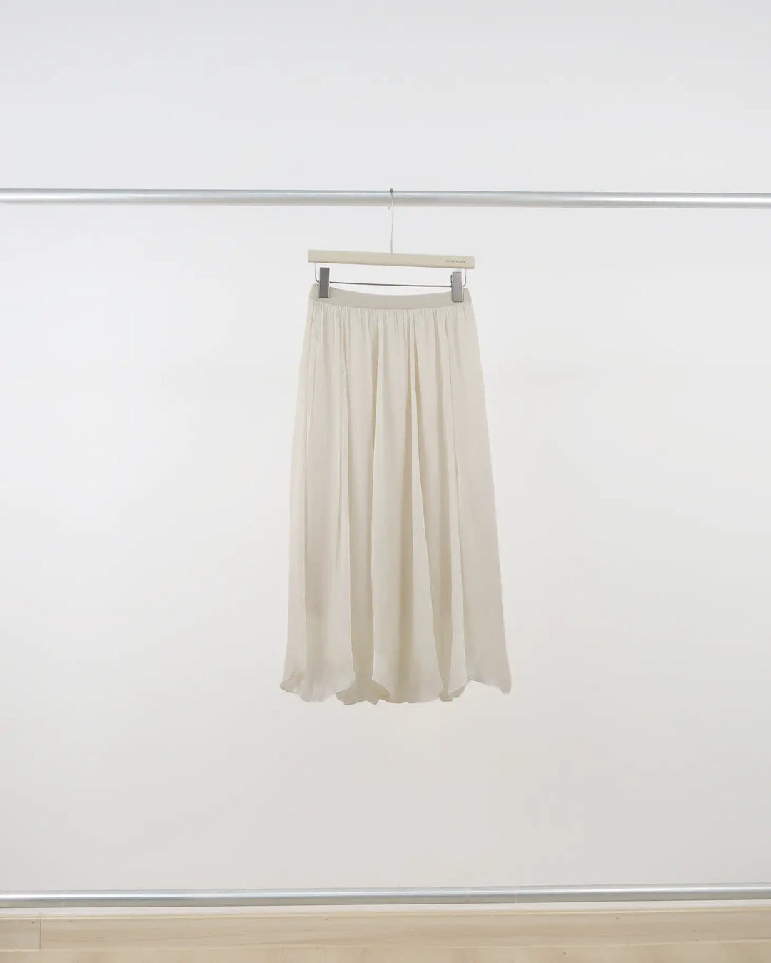 An image of a  Crème-One-Size Q3335 Midi Skirt by  Mirra Masa