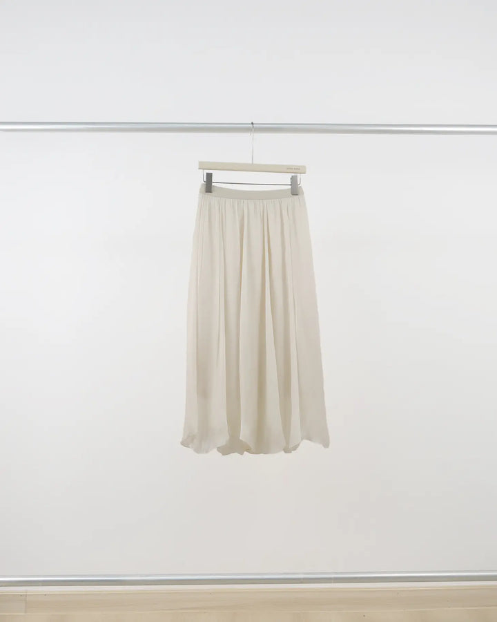 An image of a  Crème-One-Size Q3335 Midi Skirt by  Mirra Masa