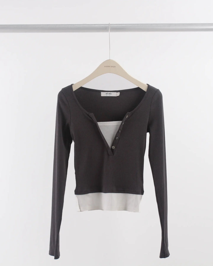 An image of a  Gray-Medium S0532 Layered Knit Top by  Mirra Masa