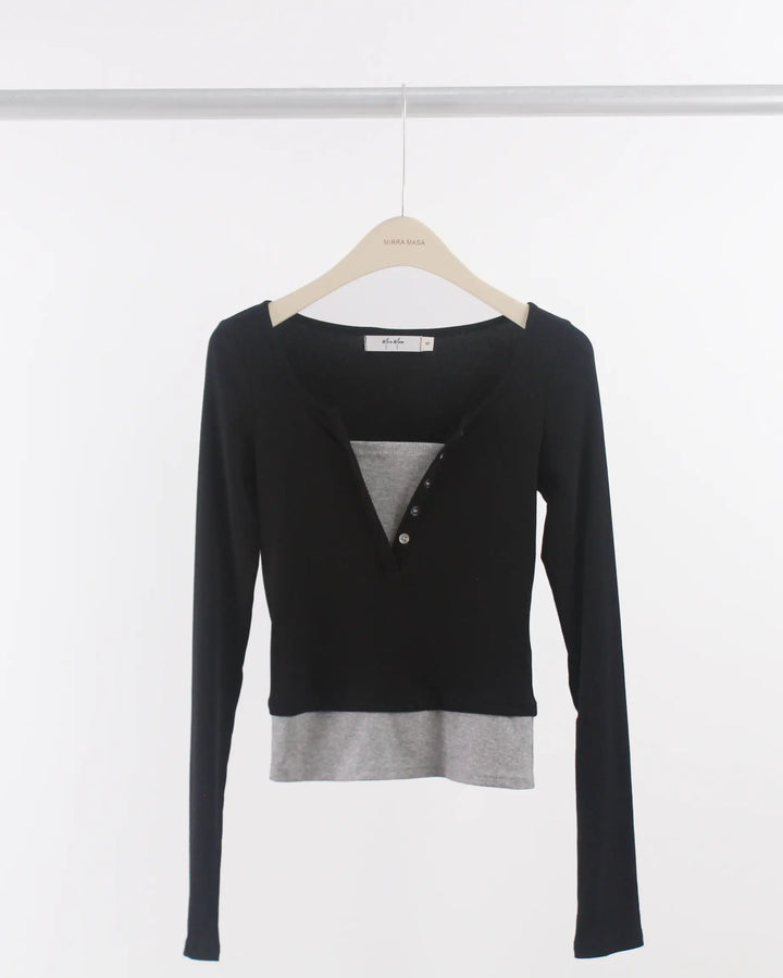 An image of a  Black-Medium S0532 Layered Knit Top by  Mirra Masa