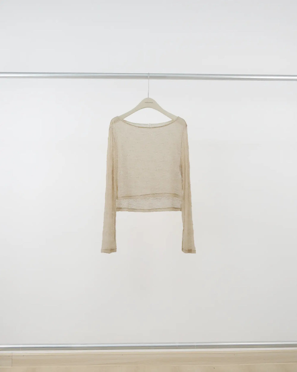 An image of a  Almond-One-Size U753 Knit Top by  Mirra Masa