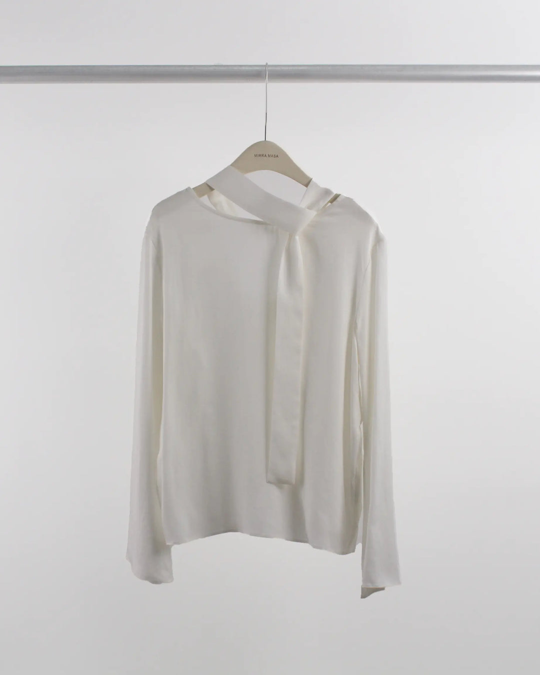 An image of a   Y10150 Open Back Blouse by  Mirra Masa